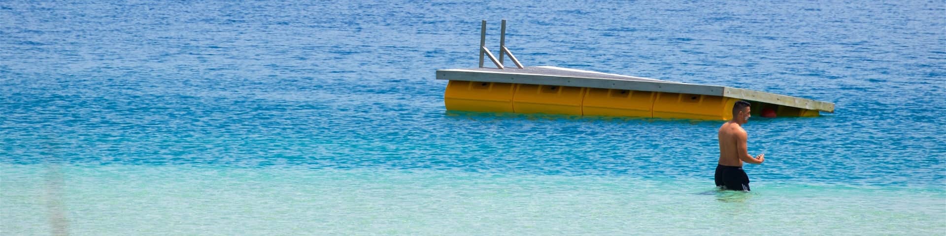 Kai Iwi Lakes which includes a lake or waterhole and swimming as well as an individual male