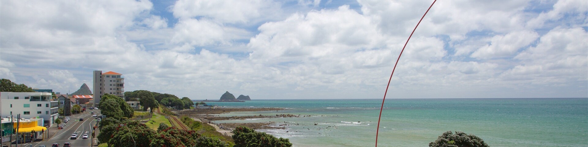 Wind Wand showing general coastal views, rocky coastline and a bay or harbor