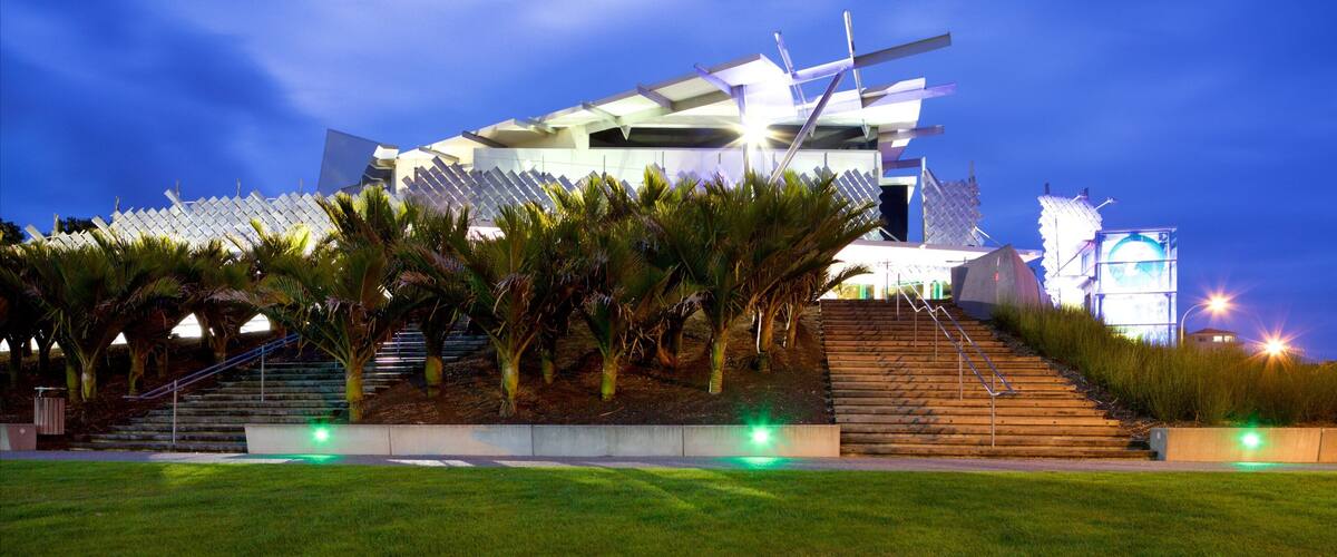 Puke Ariki featuring night scenes and modern architecture