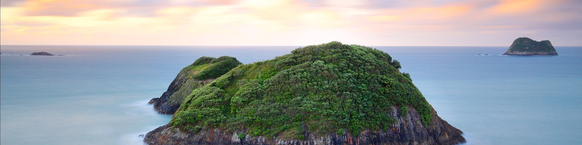 Sugar Loaf Marine Reserve which includes a sunset, a bay or harbor and island views