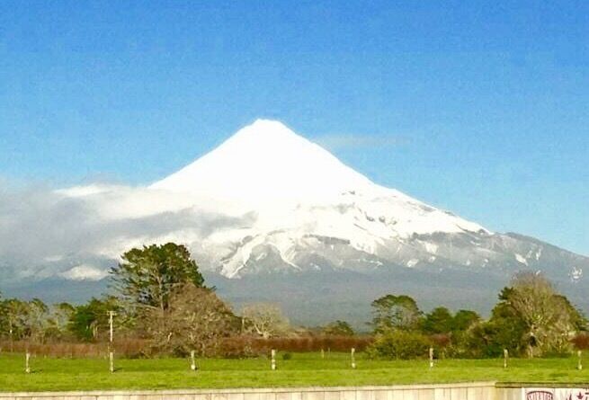 A snow-capped mountain with a clear sky.
