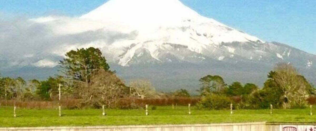 A snow-capped mountain with a clear sky.