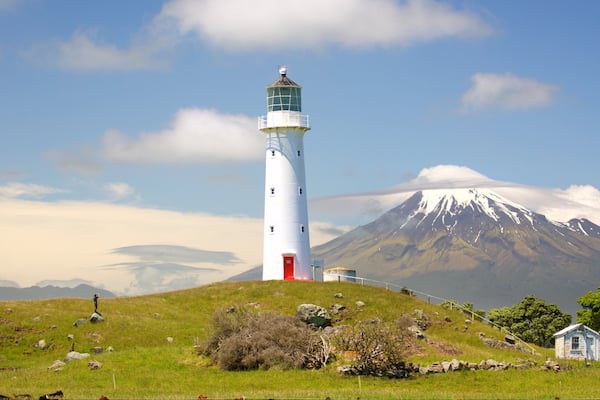 Cape Egmont Lighthouse showing mountains, tranquil scenes and a lighthouse