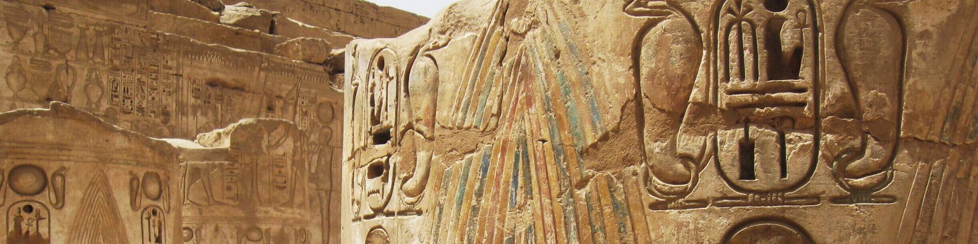 What remains of giant columns at Medinet Habu, with the name of Ramesses Hekaiunu, the last of the great pharaohs, inscribed on them. #architecture