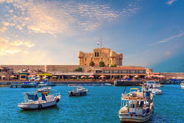 Boats in the harbour near famous Citadel of Qaitbay, Alexandria, Egypt