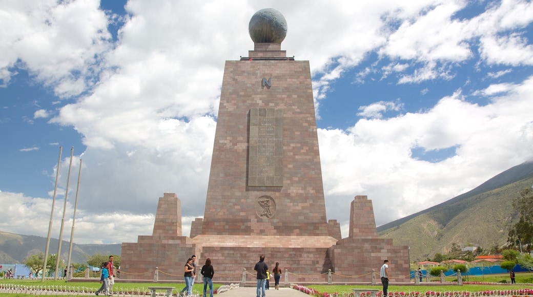 Monument to the Equator featuring a park and a monument as well as a large group of people