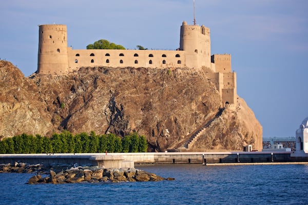 Al Jalali Fort which includes general coastal views and a castle