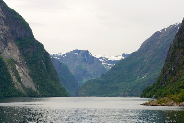 Naeroyfjord which includes mountains and a lake or waterhole