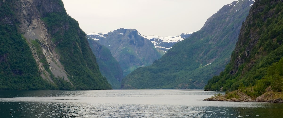 A fjord with steep cliffs and a calm lake.
