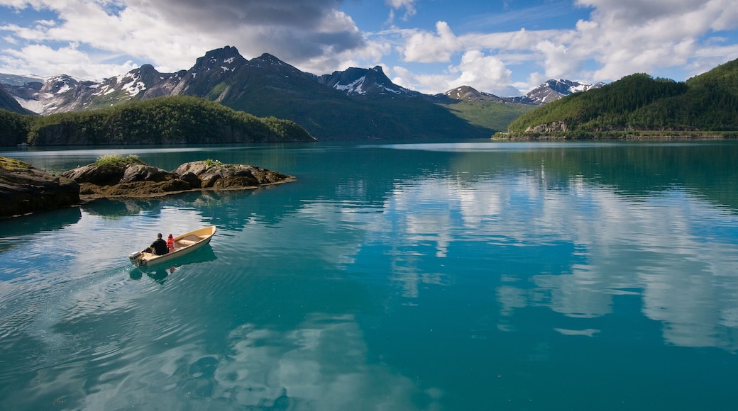 Small boat with two persons on Norwegian fjord
