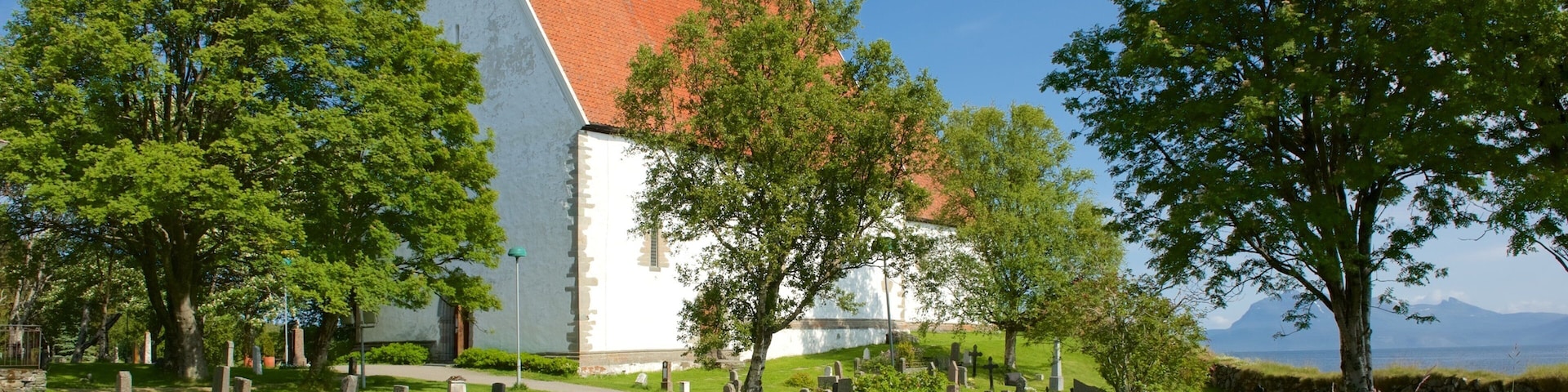 Trondenes Church featuring a church or cathedral and a cemetery