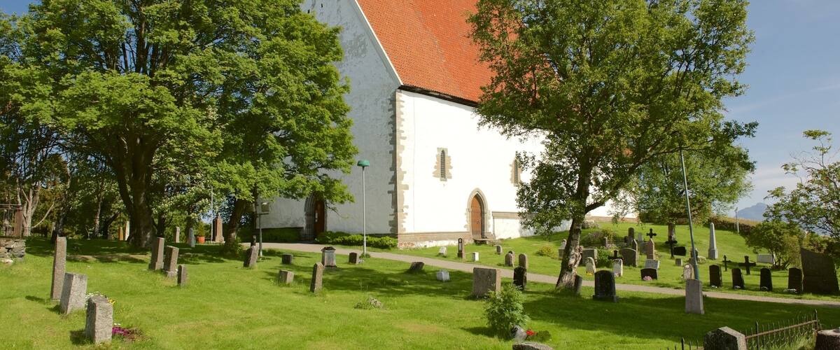 Trondenes Church featuring a church or cathedral and a cemetery
