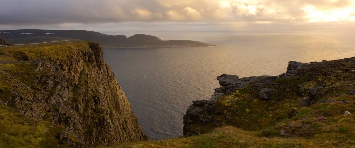 Knivskjellodden showing a sunset and a lake or waterhole