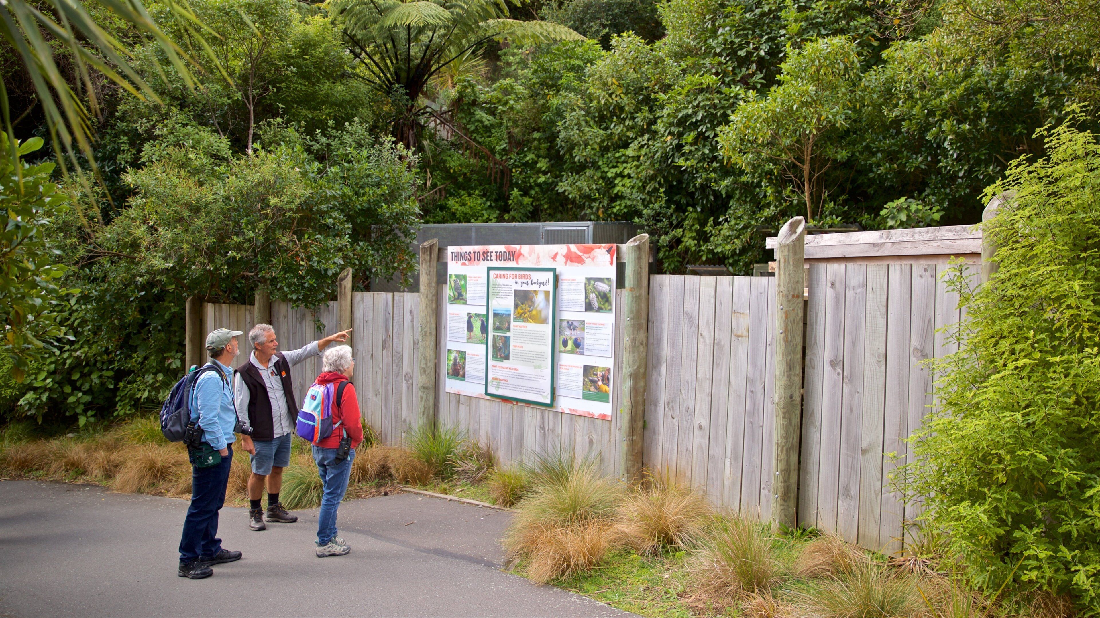 Zealandia showing signage as well as a small group of people