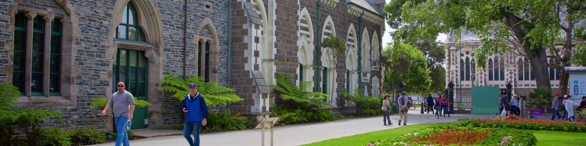 Canterbury Museum which includes a park and heritage architecture as well as a small group of people