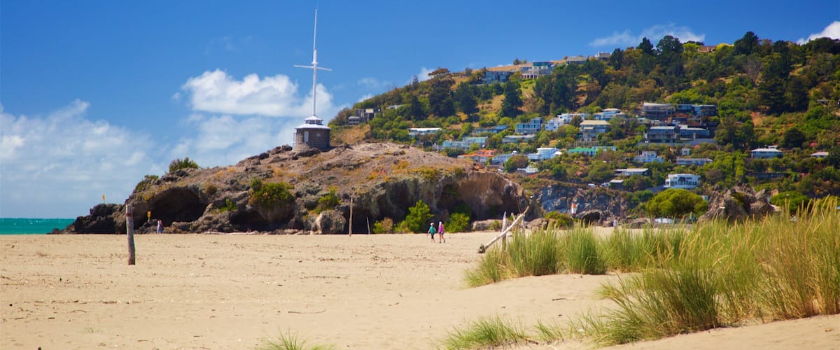 Sumner Beach which includes a sandy beach, general coastal views and a coastal town