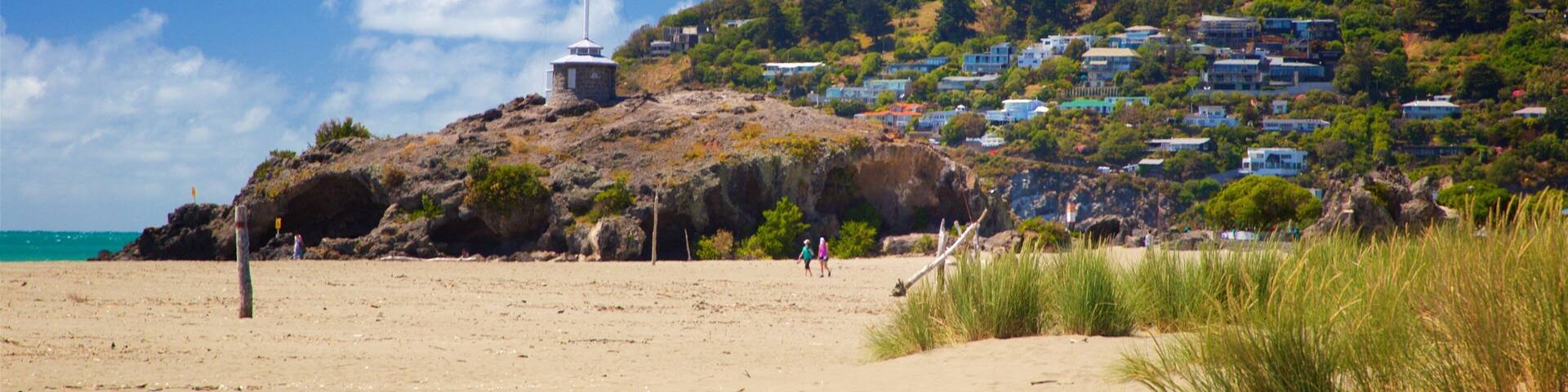 Sumner Beach which includes a sandy beach, general coastal views and a coastal town
