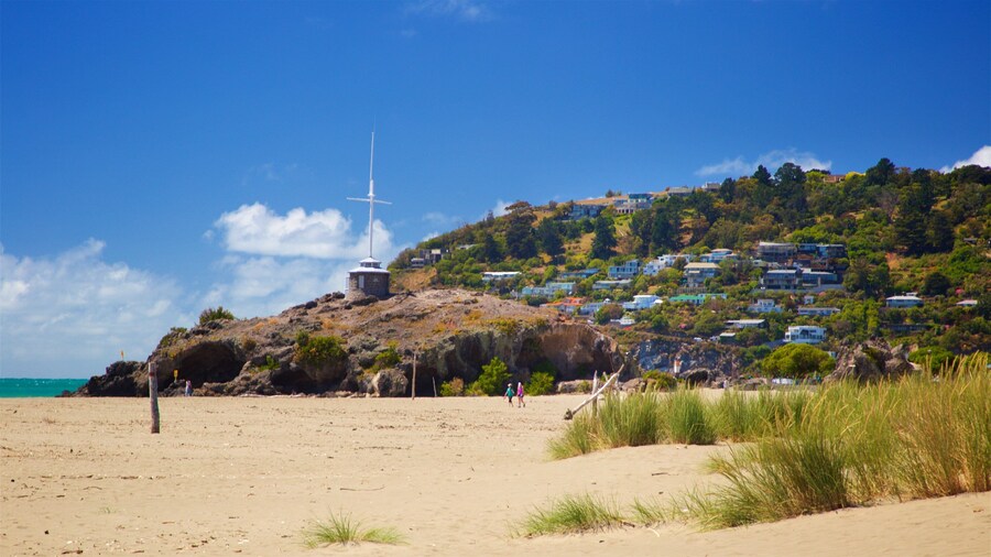 Sumner Beach which includes a sandy beach, general coastal views and a coastal town