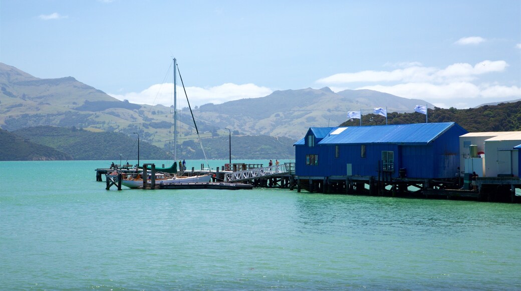 Akaroa Wharf featuring mountains, a bay or harbor and sailing