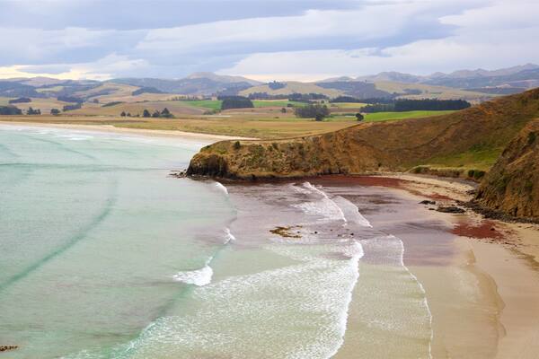 Moeraki Lighthouse showing general coastal views, waves and tranquil scenes