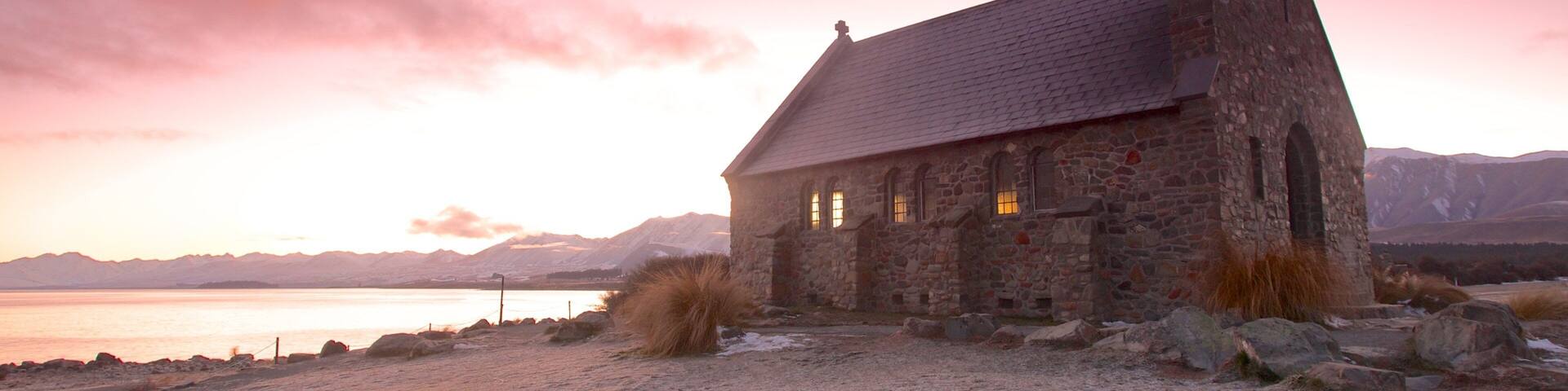 Church of the Good Shepherd which includes a church or cathedral and a sunset