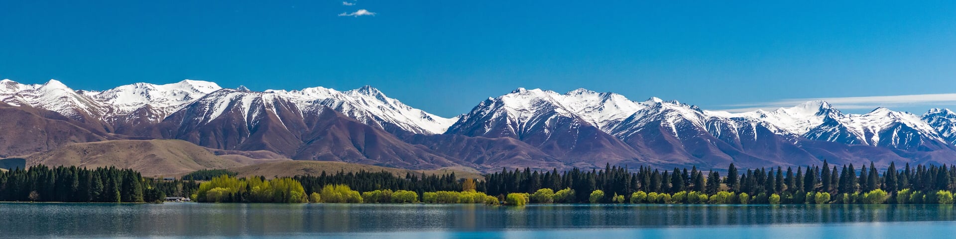 Lake Ruataniwha, New Zealand, South Island, trees and mountains, azure water reflections