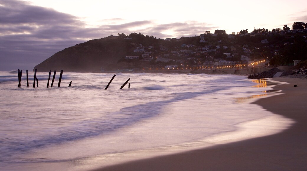 St. Clair Beach showing a beach, a bay or harbor and a coastal town
