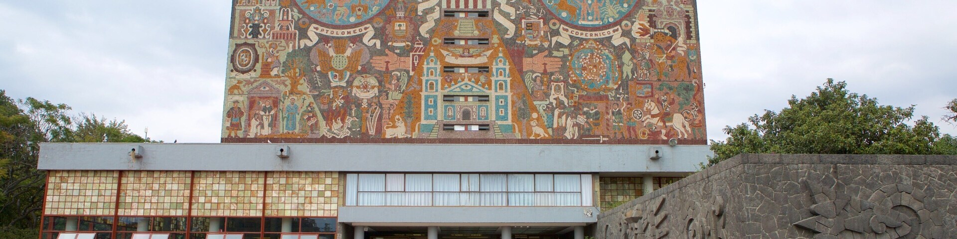 National Autonomous University of Mexico which includes outdoor art and a garden as well as a small group of people