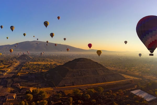 Sunrise on hot air balloon over the Teotihuacan pyramid