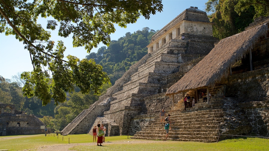 Pre-Hispanic City and National Park of Palenque showing heritage architecture and a garden as well as a small group of people