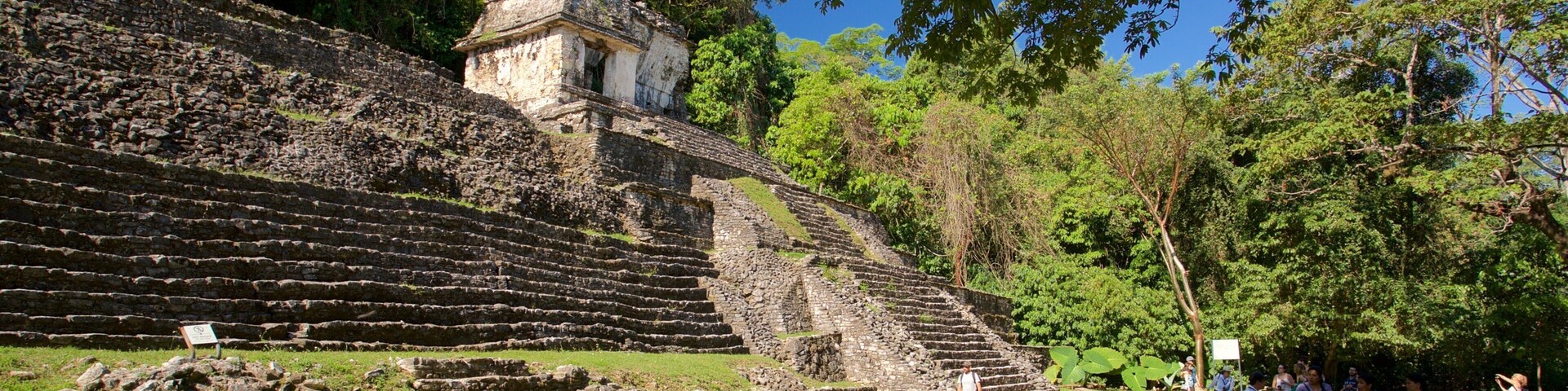 Pre-Hispanic City and National Park of Palenque featuring heritage architecture as well as a small group of people