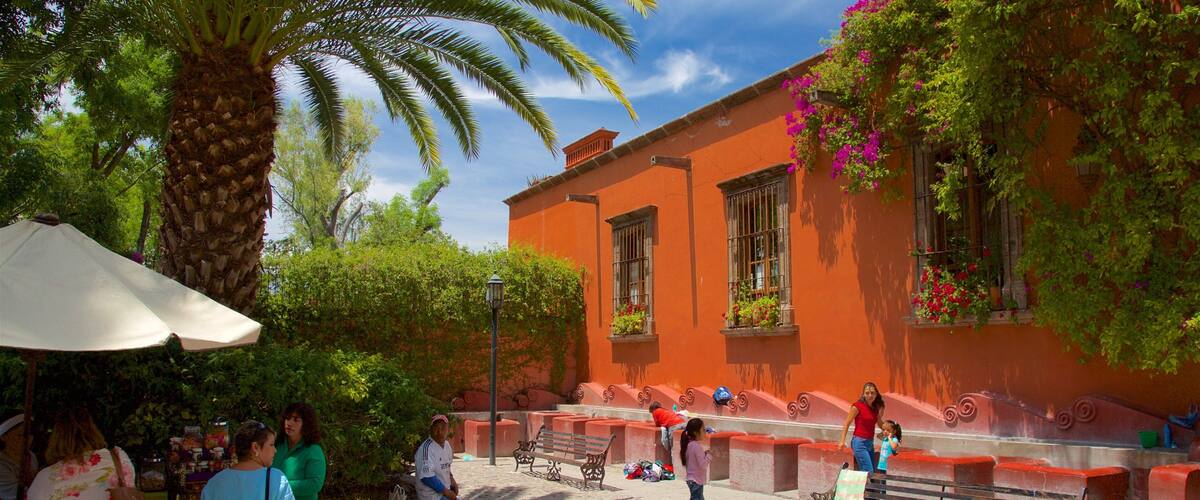 Juarez Park which includes a square or plaza as well as a small group of people