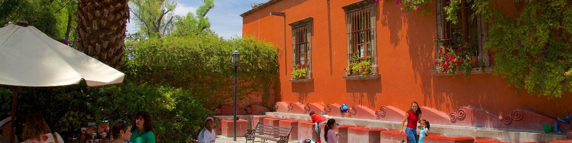 Juarez Park which includes a square or plaza as well as a small group of people