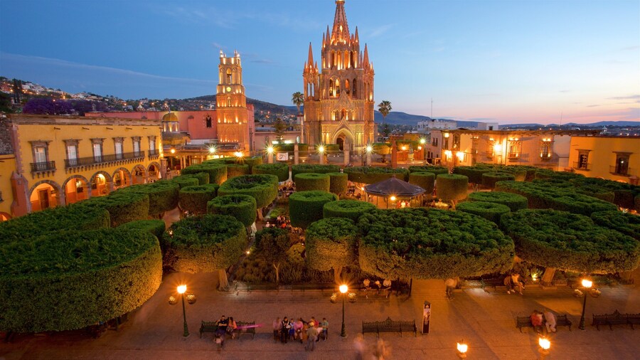 Church of San Miguel Arcángel which includes a garden, a sunset and heritage architecture