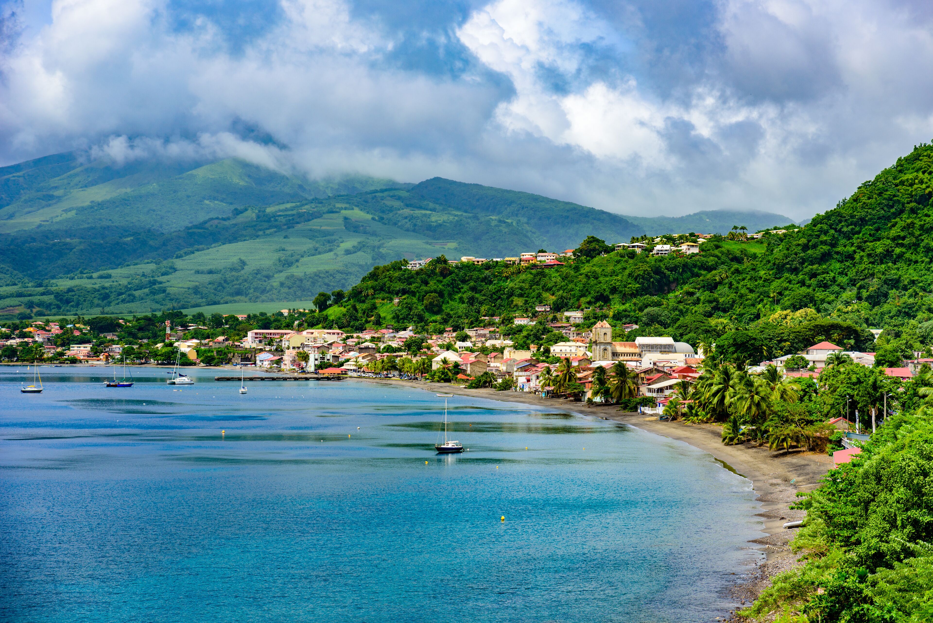 Paradise coast at Saint Pierre with Mt. Pelee, active volcanic mountain in Martinique, Caribbean Sea