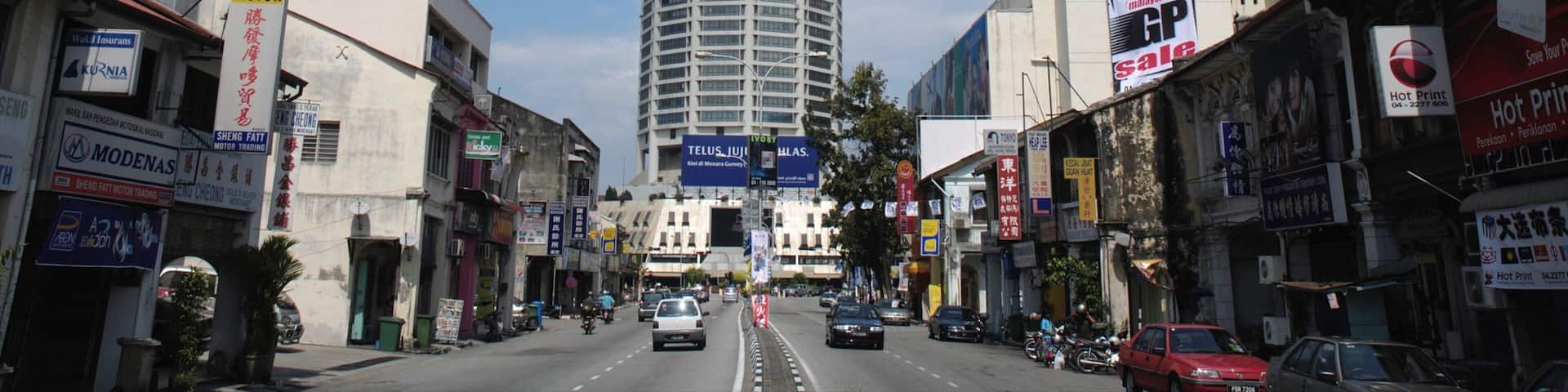 KOMTAR showing a skyscraper, a city and city views