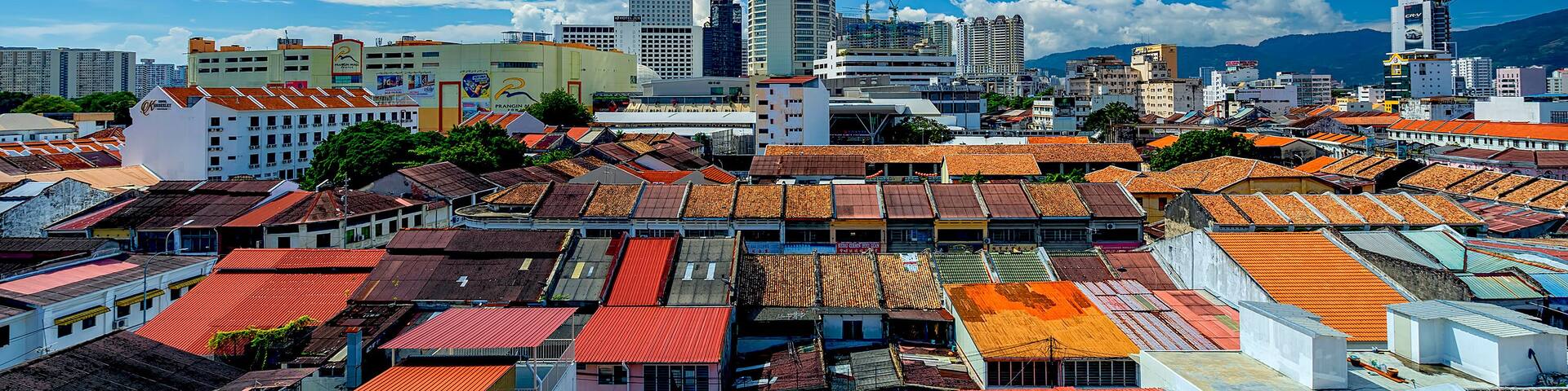 Penang,Malaysia-December 25th,2018:Georgetown cityscape view of the old heritage buildings rooftop against the KOMTAR building.Penang is one of the heritage city given by UNESCO.