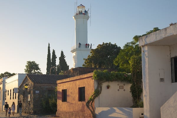 Colonia del Sacramento Lighthouse showing a sunset, a lighthouse and heritage architecture
