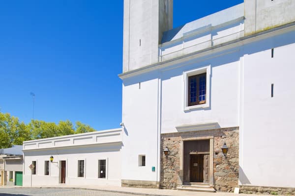 Matriz Church which includes heritage architecture, street scenes and a small town or village
