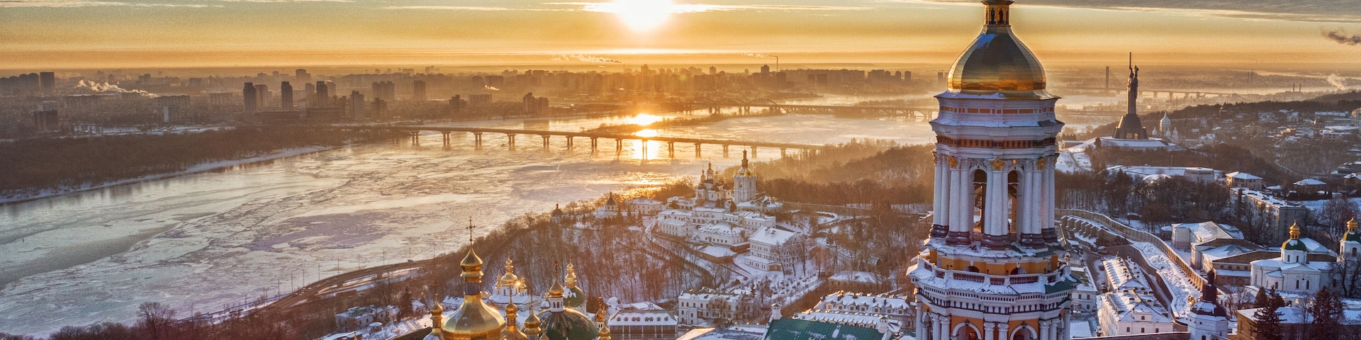 Orange sunset and cloud over cityscape Kiev, Ukraine, Europe