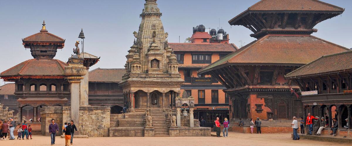 A historic temple complex with intricate architecture and a clear blue sky.