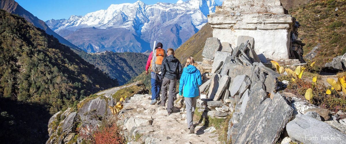 Trekking to Everest Base Camp. Actually, in this photo, we are trekking back to Lukla. Off in the distance, sitting on the ridge, is the town of Tengboche. #kids #hiking #adventure #trekking
For more amazing photos, check out this post: http://www.earthtrekkers.com/everest-base-camp-trek-in-18-amazing-photos/