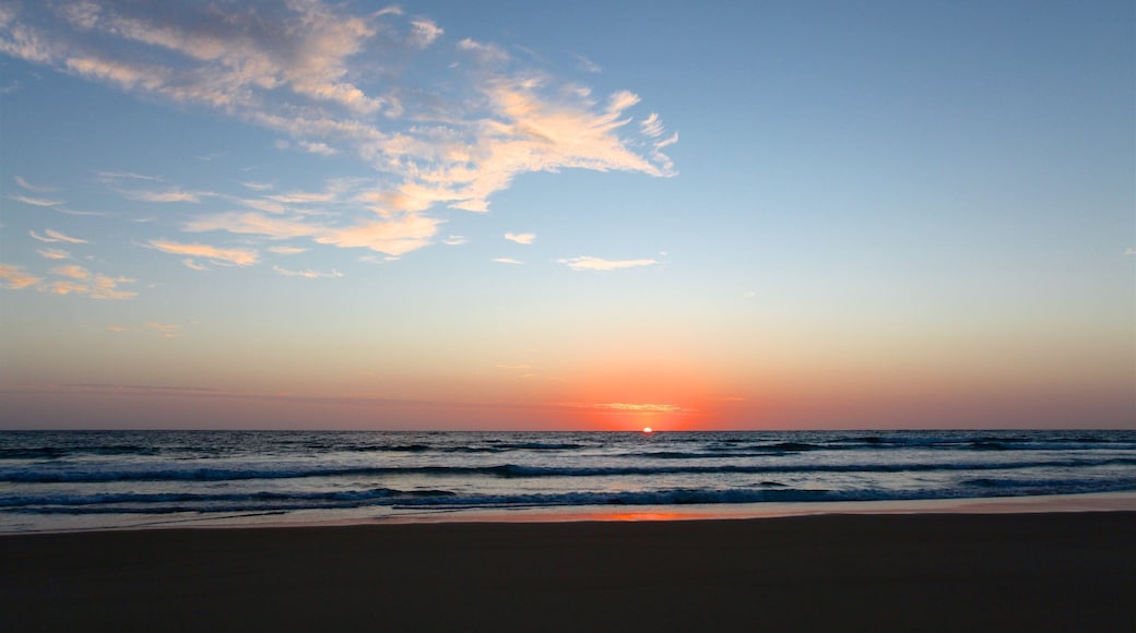 Tofo Beach which includes a sunset, a beach and general coastal views