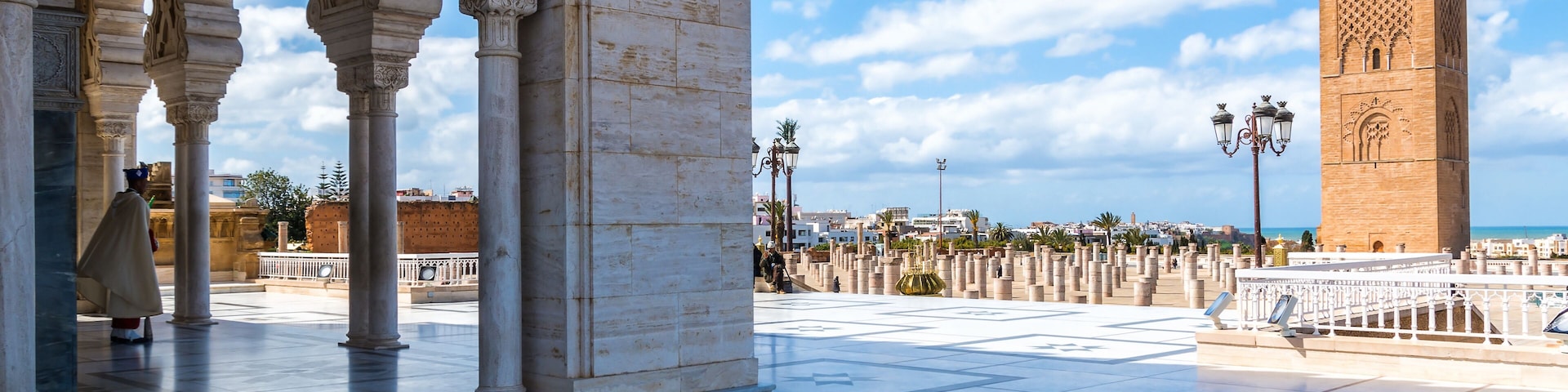 RABAT, MOROCCO - MARCH 20, 2018: Beautiful Mausoleum of Mohammed V and square with Hassan tower in Rabat on sunny day. March 20, 2018 in Rabat, Morocco