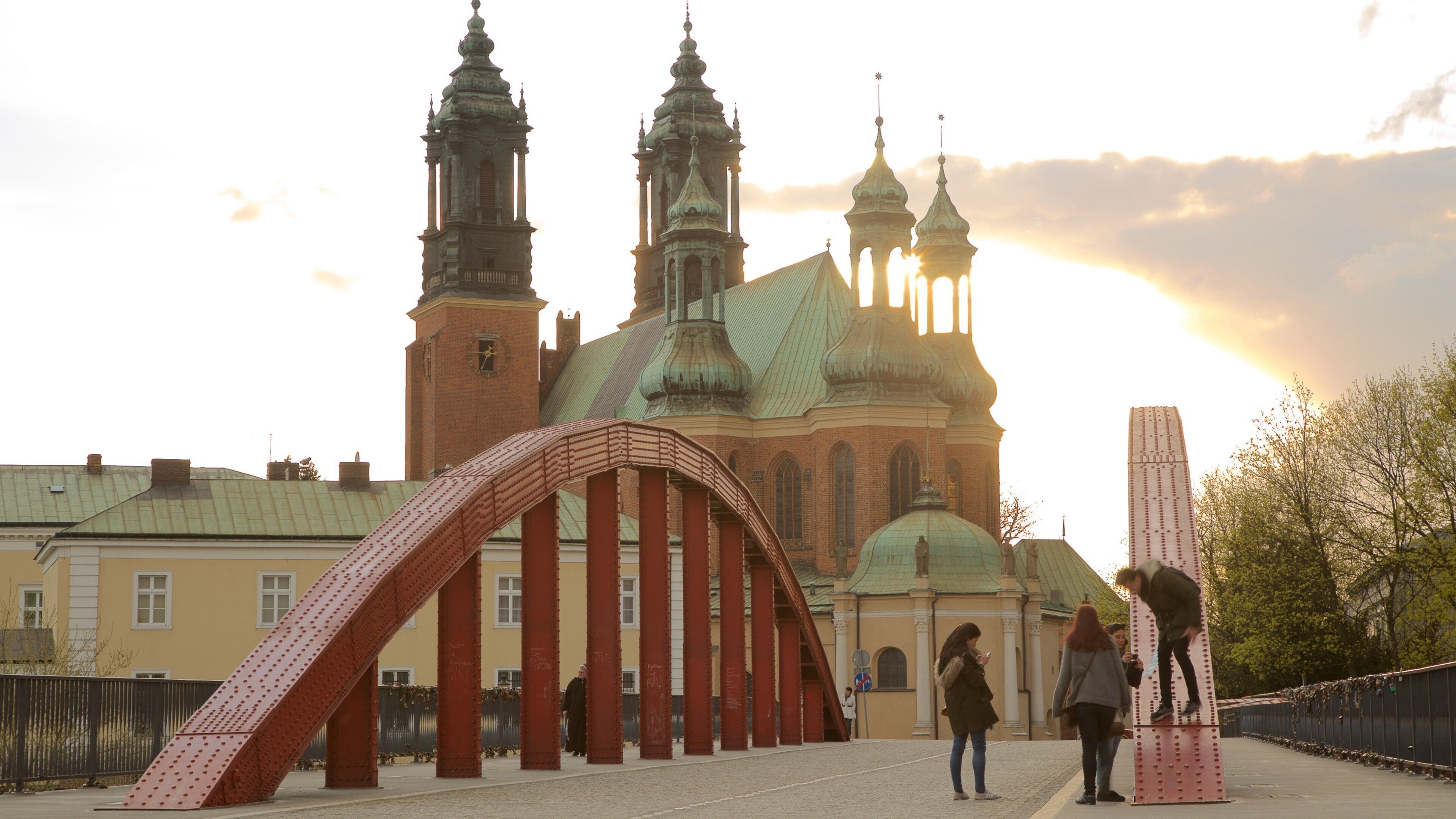 Archcathedral Basilica of St. Peter and St. Paul featuring a church or cathedral, a sunset and a bridge