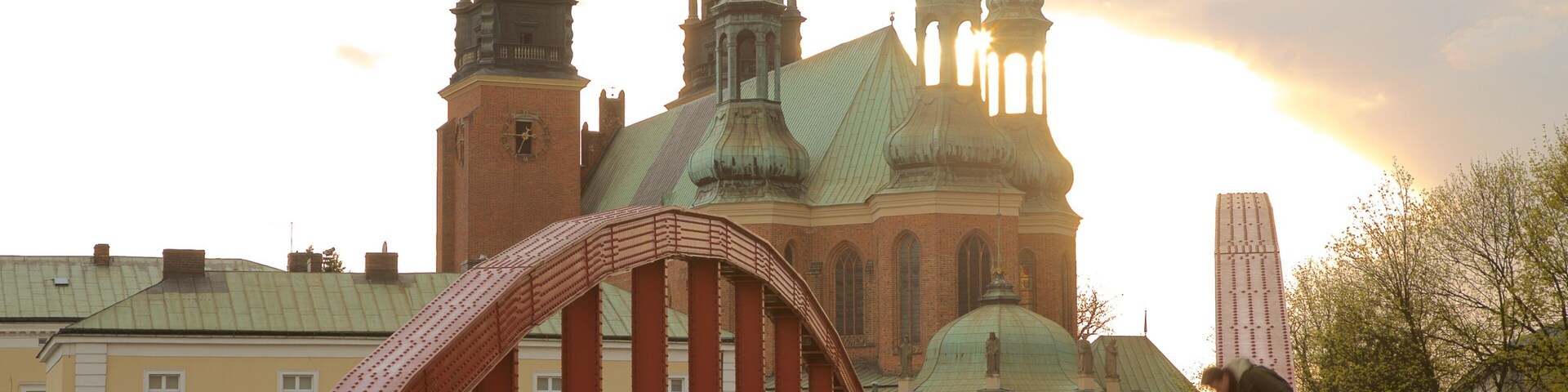 Archcathedral Basilica of St. Peter and St. Paul featuring a sunset, a bridge and a church or cathedral