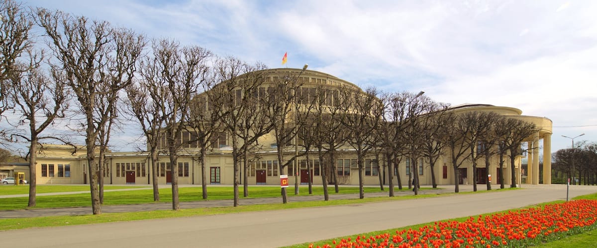 Centennial Hall featuring heritage architecture and flowers