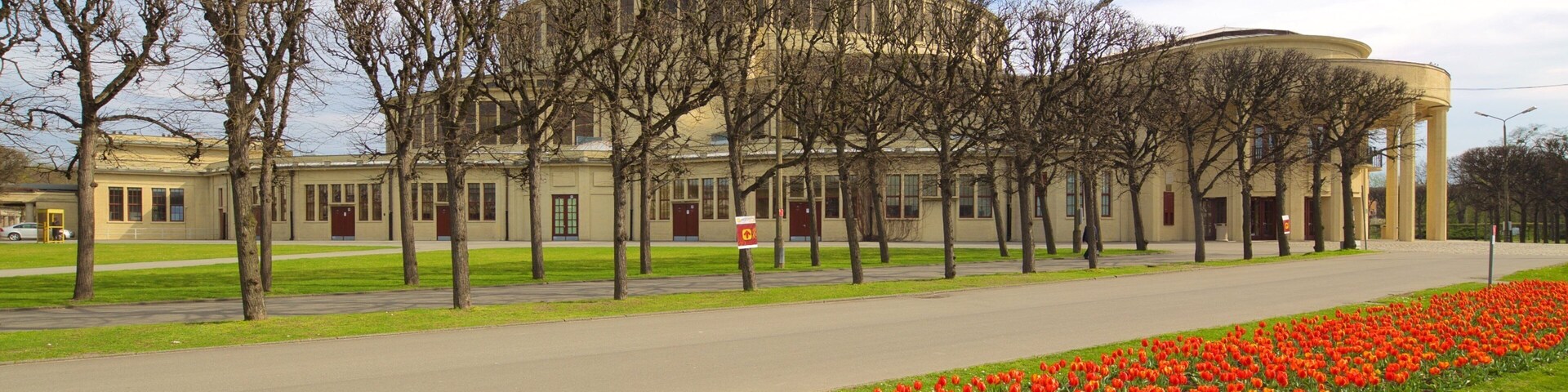 Centennial Hall featuring heritage architecture and flowers