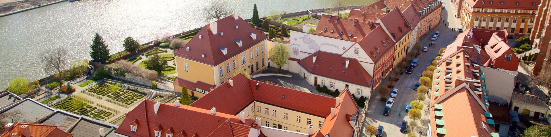 Wroclaw Cathedral which includes a river or creek and a city
