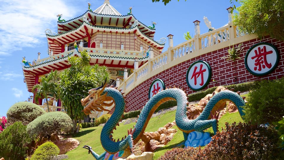 Philippines Taoist Temple showing a garden and a statue or sculpture